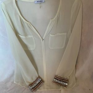 Sheer blouse with cuff detail